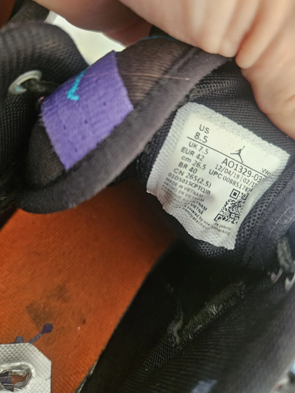 Jordan Black and White Mid-Top Sneakers with Teal & Purple Accent
